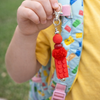 Hand holding Coping Life handmade fidget keychain showing colorful bead textures and length
