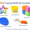 Coping Skills Kids Kit with breathing sticker, scented foam, squish cubes, silicone sensory stone, and LEGO keychain on a white background.